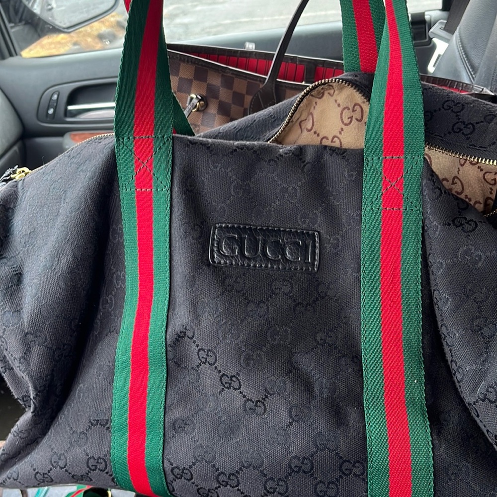 Black Gucci duffel bag